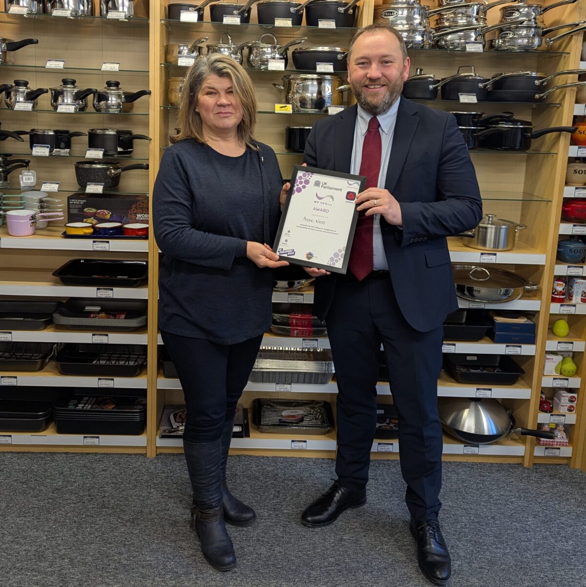 Ian presents Anne Ness with the MP HERoes Award